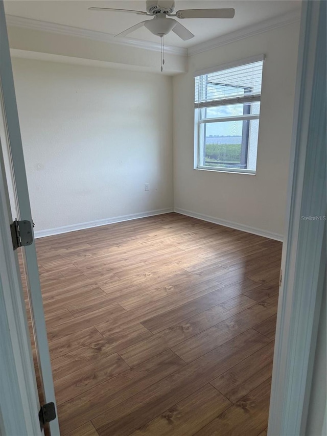 1020 Tidewater Shores Loop Unit 108, Bradenton, FL 34208 - empty room featuring crown molding, a ceiling fan, and wood finished floors