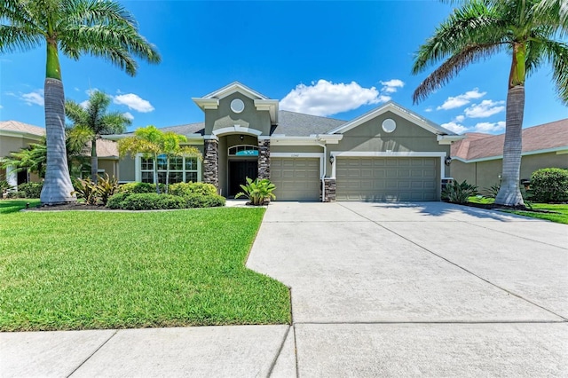 view of front of home with a garage and a front lawn