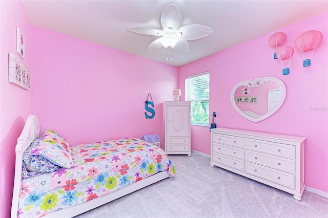 bedroom with light carpet and ceiling fan