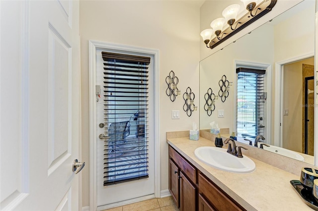 bathroom featuring tile patterned flooring and vanity