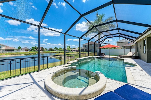 view of swimming pool with a patio area, a water view, an in ground hot tub, and glass enclosure