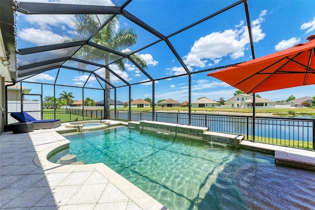 view of swimming pool with an in ground hot tub, a water view, glass enclosure, and a patio area