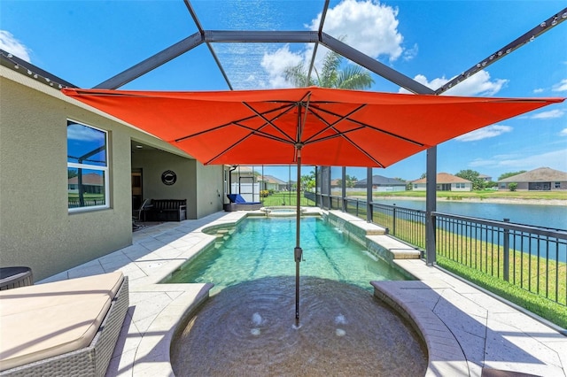 view of pool featuring a patio, a water view, and glass enclosure