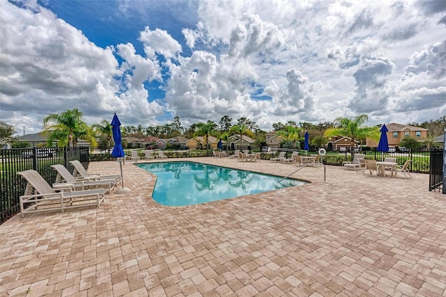 view of swimming pool featuring a patio