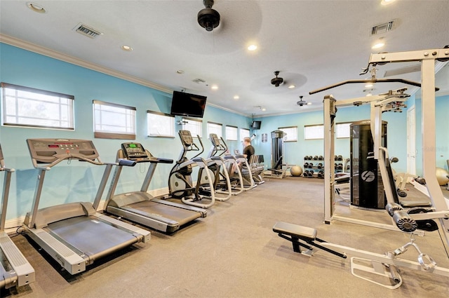 gym with ceiling fan and ornamental molding