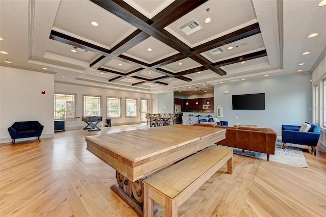 dining room with beam ceiling, light hardwood / wood-style floors, crown molding, and coffered ceiling