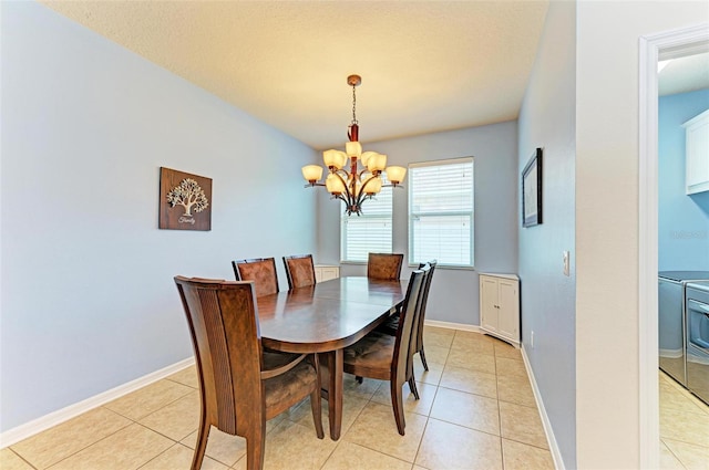 tiled dining space with a chandelier