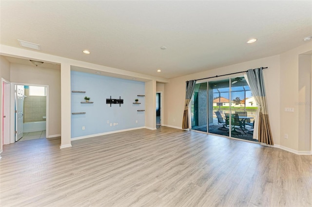 empty room with light hardwood / wood-style floors