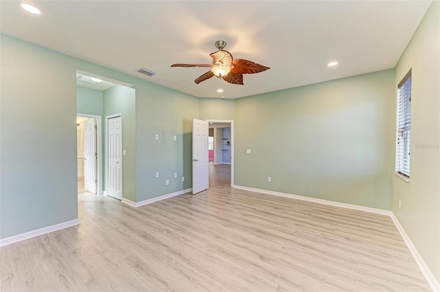 unfurnished bedroom with ceiling fan and light hardwood / wood-style flooring