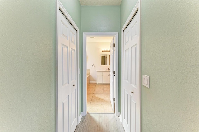 hall with light hardwood / wood-style floors