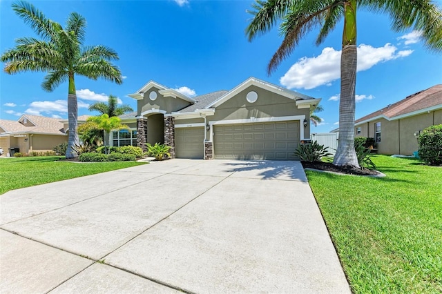 view of front of property with a front yard and a garage