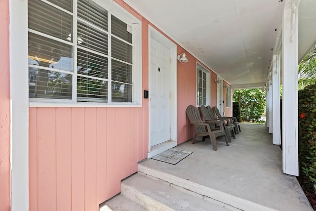 view of exterior entry featuring a porch