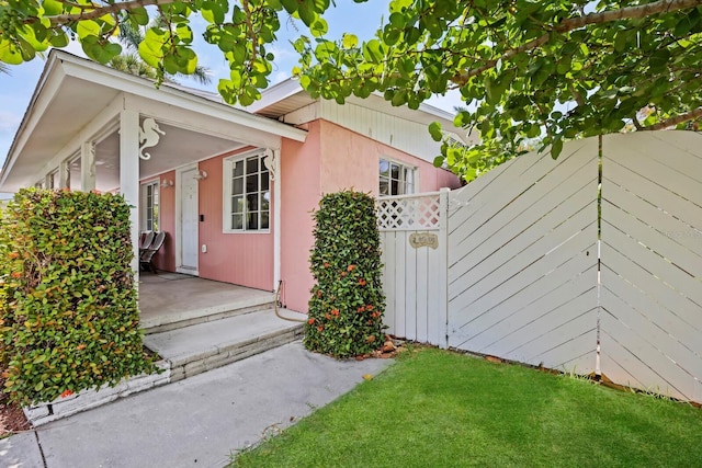 view of side of home featuring a lawn