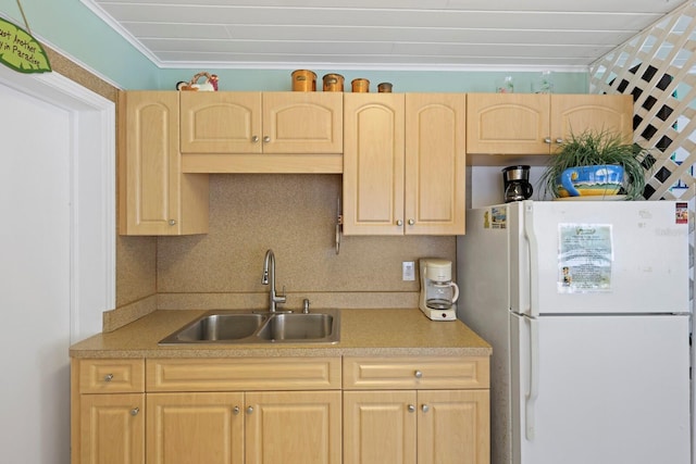 kitchen featuring white fridge, sink, and light brown cabinets