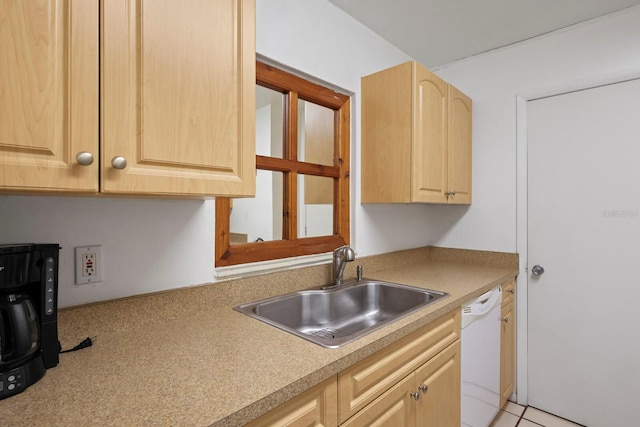 kitchen featuring light brown cabinetry, white dishwasher, light tile patterned flooring, and sink