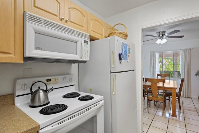 kitchen featuring ceiling fan, light brown cabinetry, light tile patterned floors, and white appliances