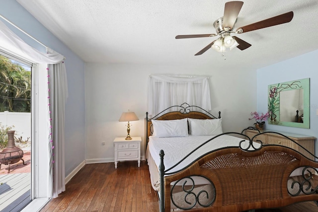 bedroom with access to outside, ceiling fan, a textured ceiling, and dark hardwood / wood-style floors