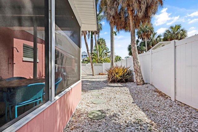 view of yard with a sunroom