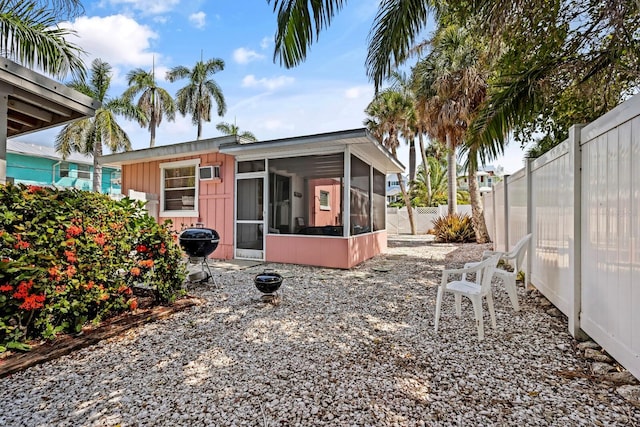 rear view of house with a sunroom