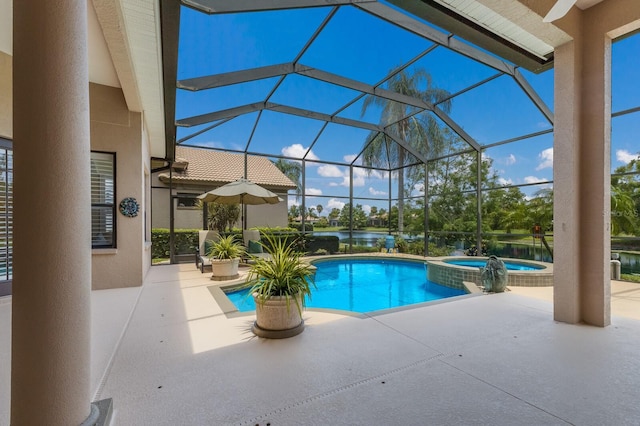 view of pool with an in ground hot tub, a lanai, and a patio