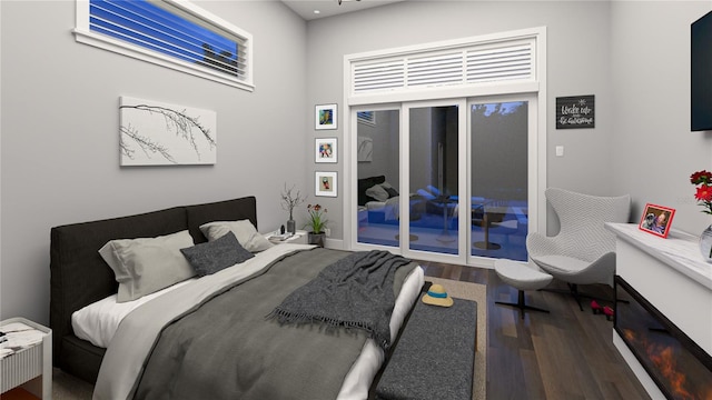 bedroom with access to outside and hardwood / wood-style floors