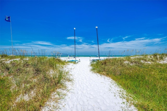 exterior space featuring a view of the beach and a water view