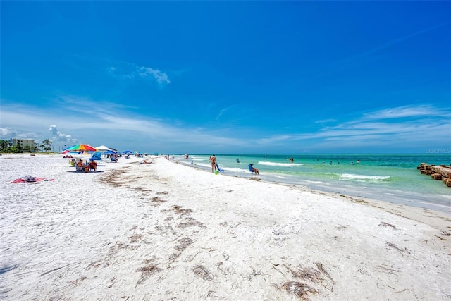 property view of water featuring a beach view