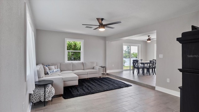 living room featuring ceiling fan