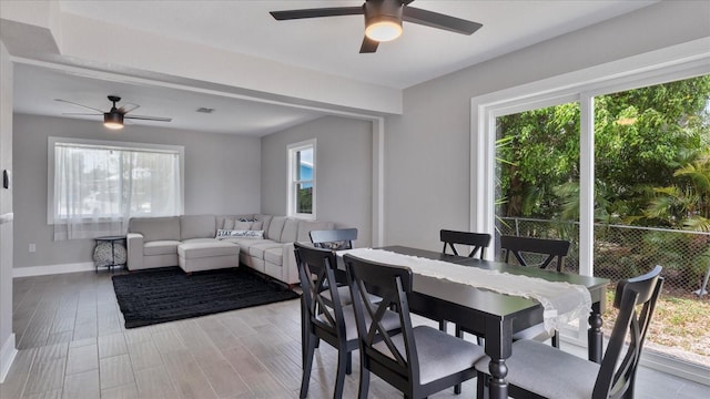 dining room featuring ceiling fan and light hardwood / wood-style floors