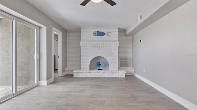 unfurnished living room featuring ceiling fan