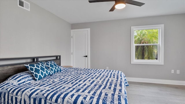 bedroom featuring light hardwood / wood-style floors and ceiling fan