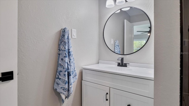 bathroom featuring ceiling fan and vanity