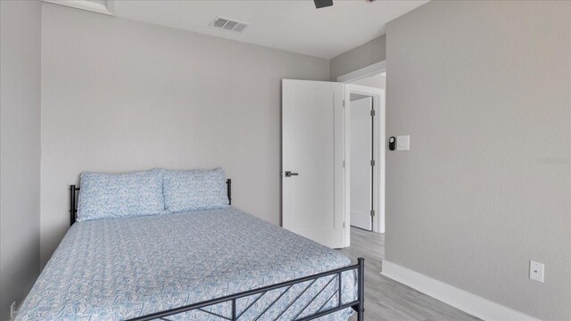 bedroom featuring hardwood / wood-style floors and ceiling fan