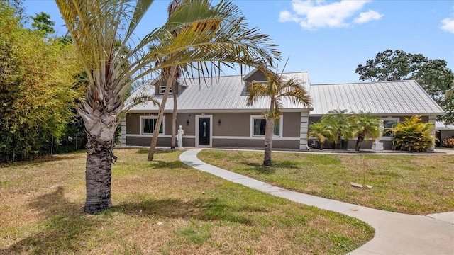 view of front of home with a front lawn