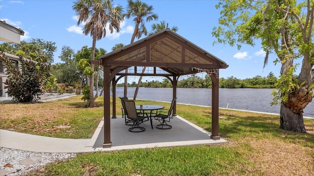 surrounding community featuring a gazebo, a patio, a water view, and a lawn