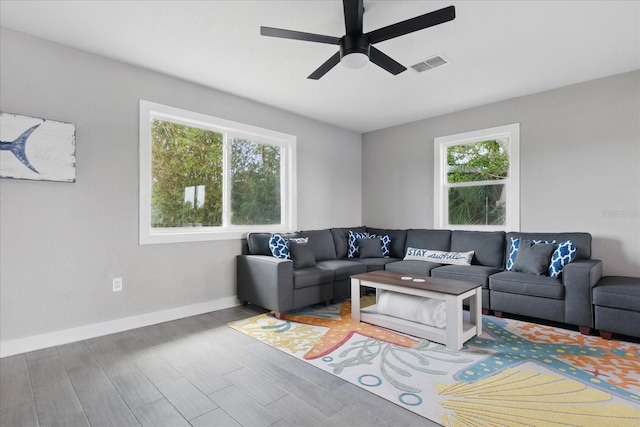 9610 SW Yacht Dr, Arcadia, FL 34269 - living area featuring visible vents, a ceiling fan, baseboards, and wood finished floors