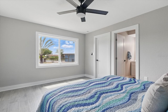 9610 SW Yacht Dr, Arcadia, FL 34269 - bedroom featuring baseboards, a ceiling fan, and wood finished floors