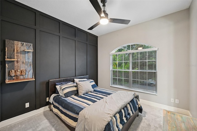 bedroom with ceiling fan and light carpet