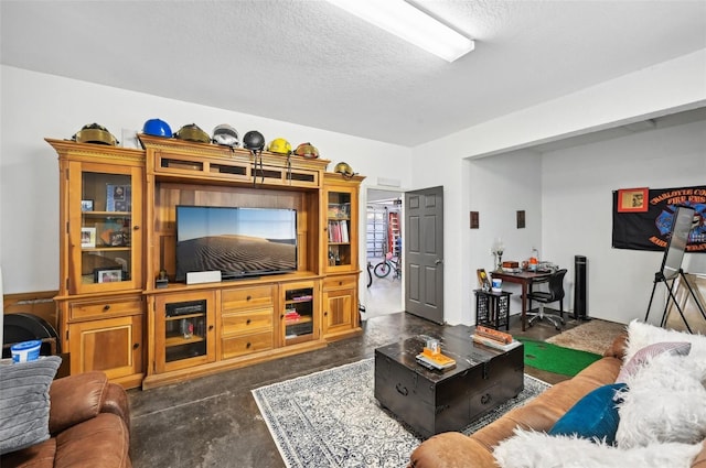 living room featuring a textured ceiling