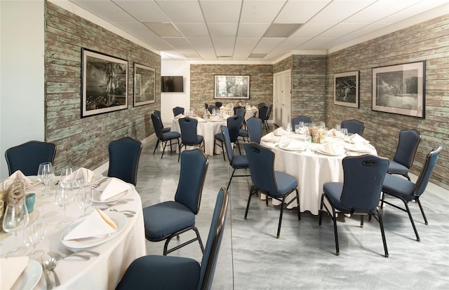 dining room featuring concrete flooring