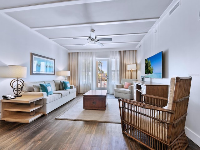 living room featuring beamed ceiling, ceiling fan, and wood-type flooring