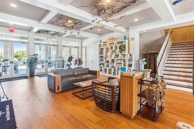 living room with french doors, beam ceiling, coffered ceiling, and wood-type flooring