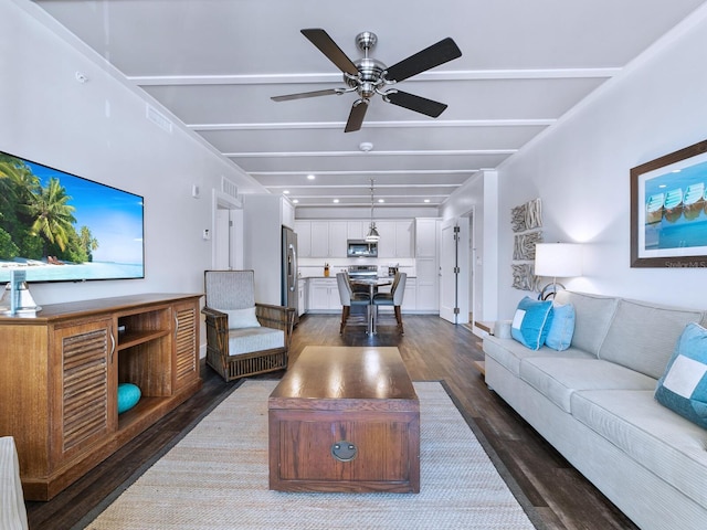 living room featuring ceiling fan and dark hardwood / wood-style flooring