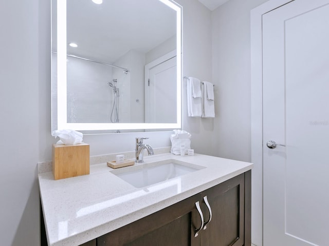 bathroom with vanity and walk in shower