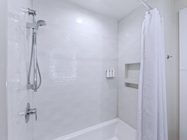 bathroom with shower / bath combination with curtain