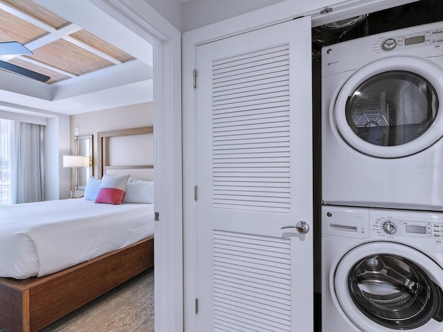 laundry area featuring stacked washer and dryer