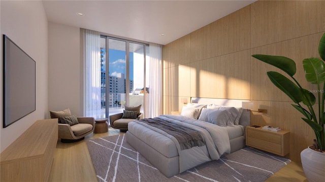 bedroom featuring wood-type flooring and floor to ceiling windows