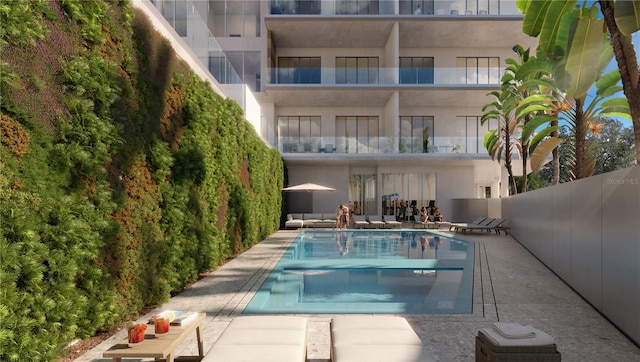 view of swimming pool featuring a patio area