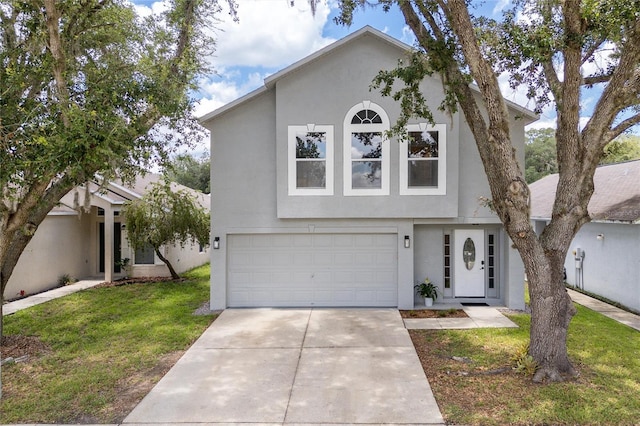 view of front of home featuring a garage and a front lawn