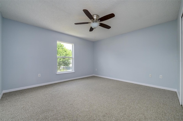 unfurnished room featuring carpet flooring, ceiling fan, and a textured ceiling